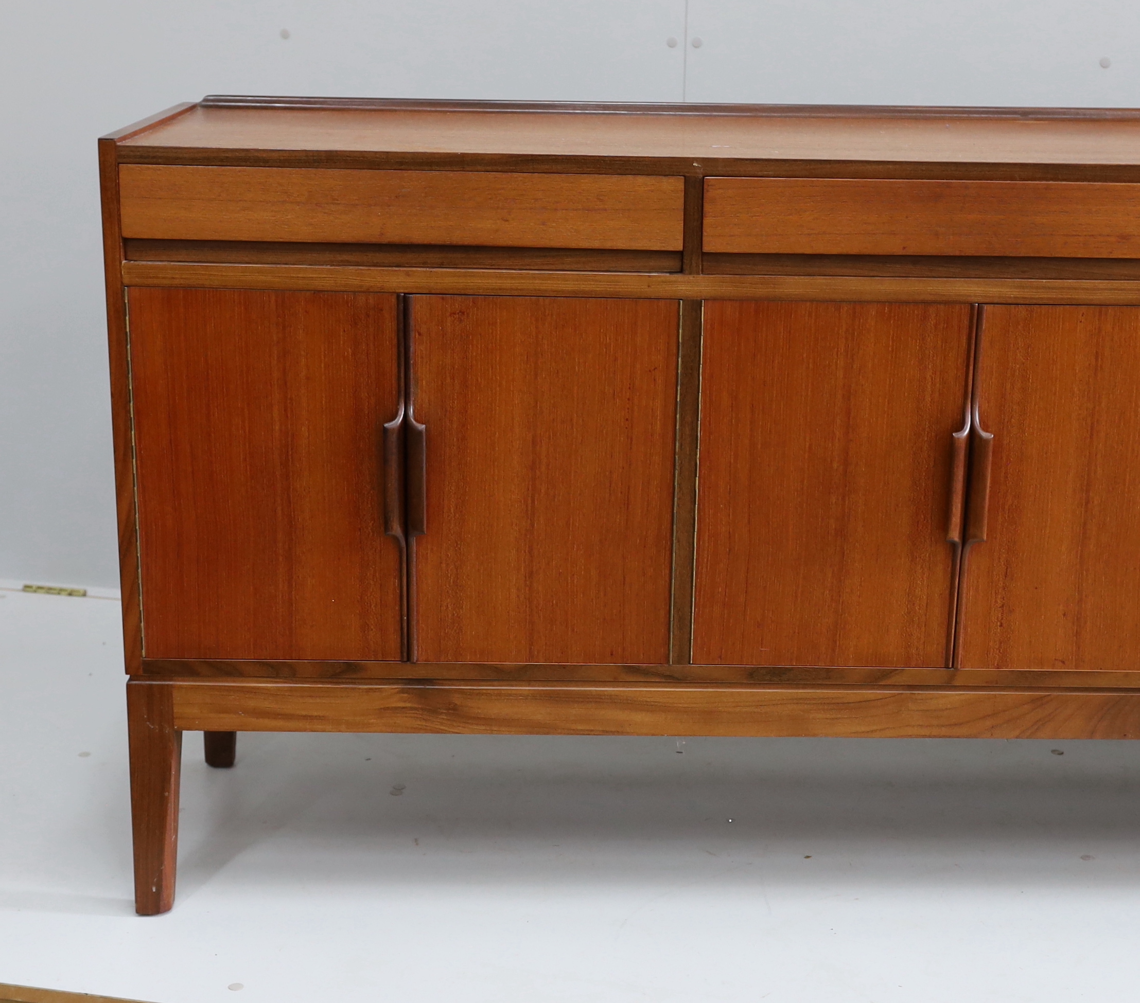 Robert Heritage for Archie Shine, a mid century teak sideboard, length 238cm, depth 46cm, height 86cm